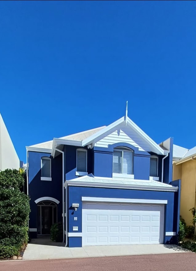 Complete blue and white two-storey home exterior painted by Lioz Painting